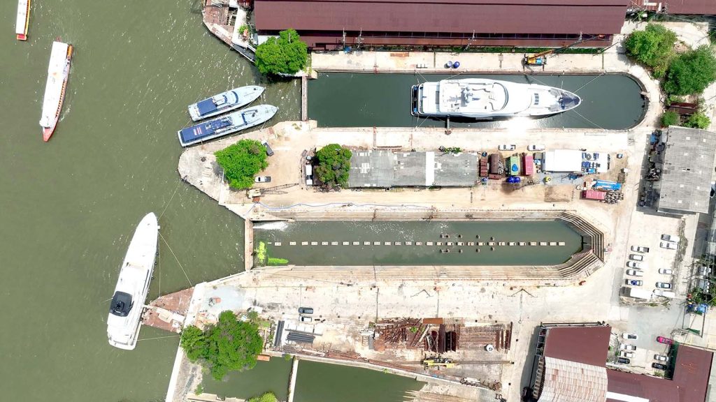 2 superyachts seen from above in clearvac Engineering Asia's refit facility at Bangkok Dock Co