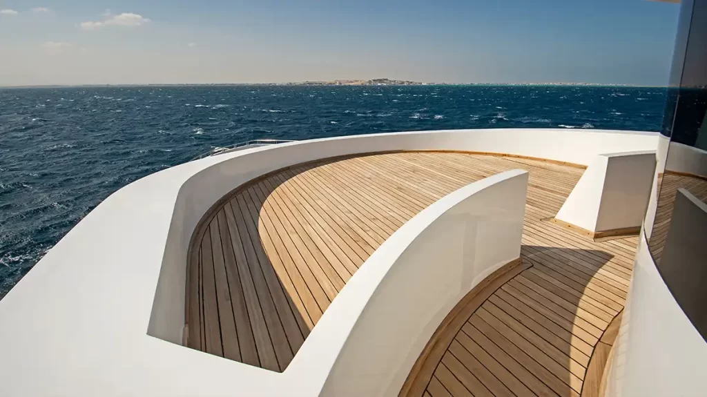 Yacht Refit Teak Decking of a superyacht with an ocean in the background