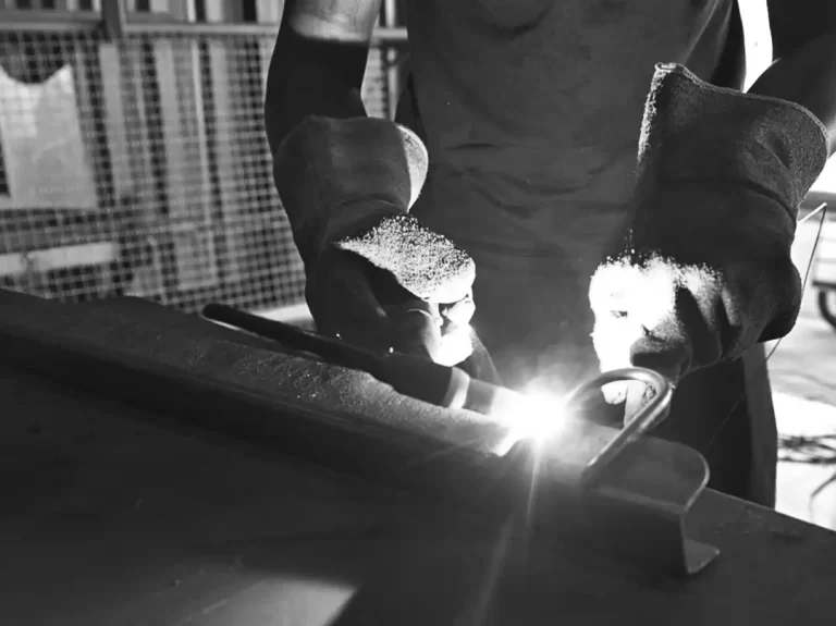 A marine mechanical engineer is seen welding stainless steel