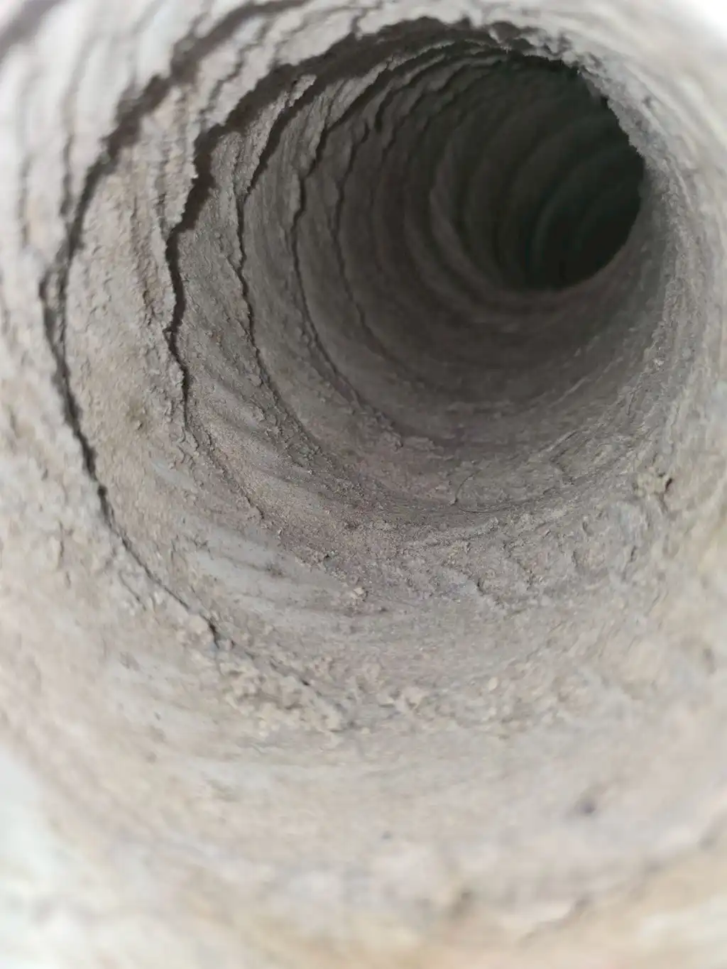 Dirty marine HVAC ventilation duct with heavy dust buildup before Clearvac air hygiene cleaning service.